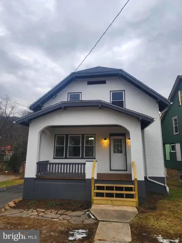 a kitchen with stainless steel appliances granite countertop a refrigerator stove a sink and a refrigerator