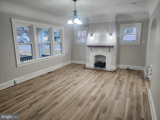 a white refrigerator freezer and a stove sitting inside of a kitchen