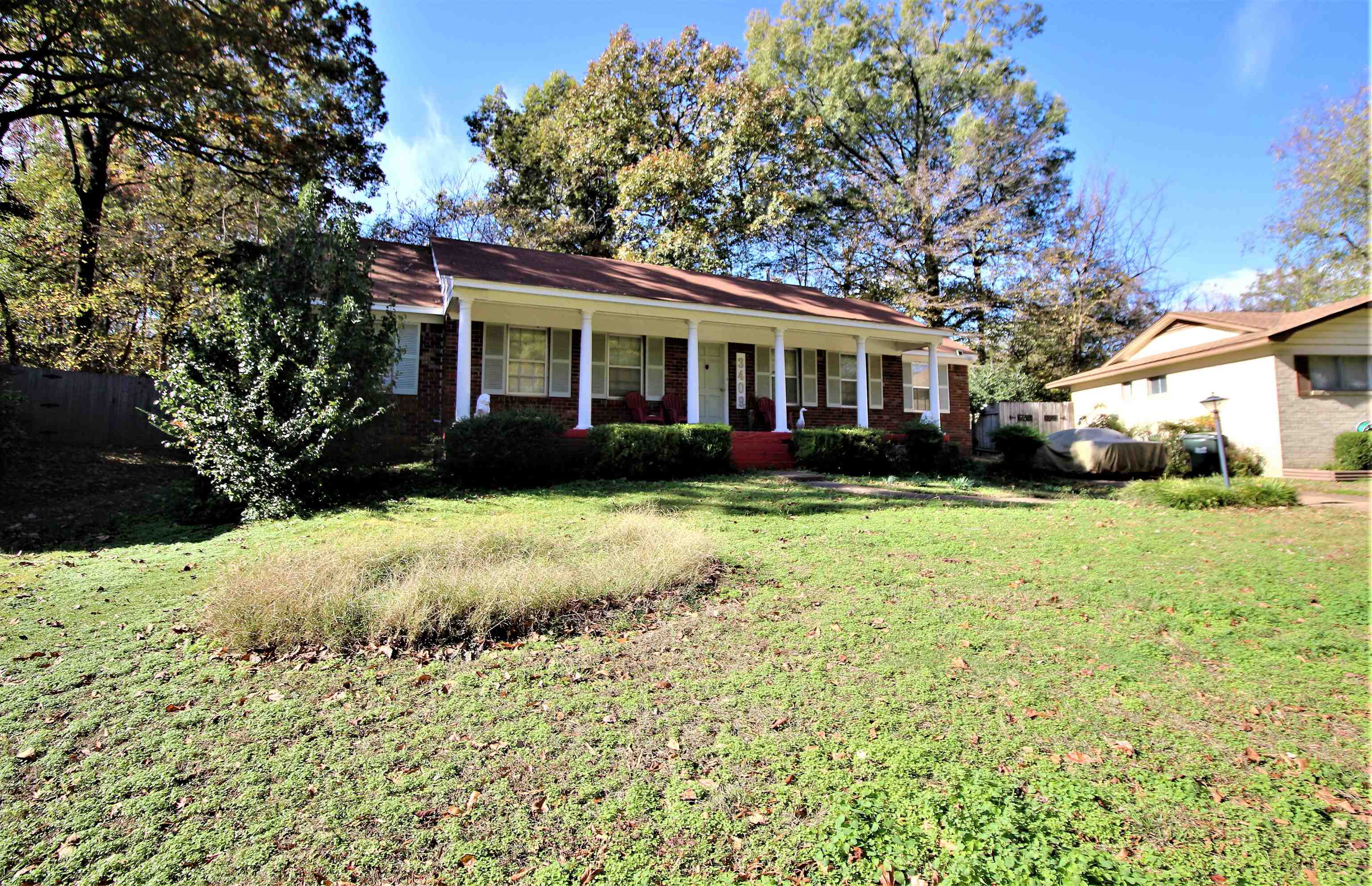 3409 Adrick Road Memphis, TN 38128 - Photo 2 of 14 a front view of a house with a yard and trees