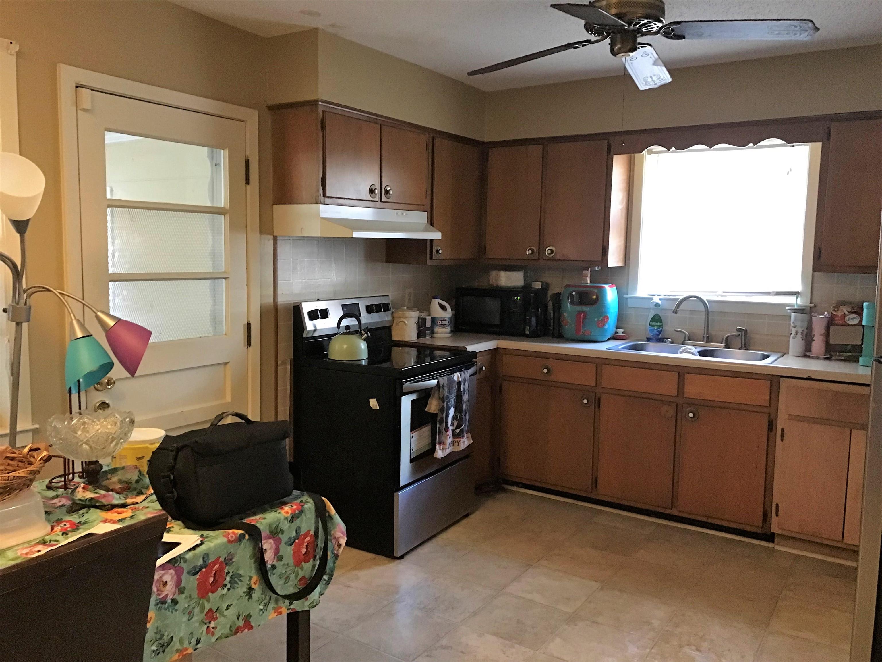 3409 Adrick Road Memphis, TN 38128 - Photo 6 of 14 a kitchen with stainless steel appliances granite countertop a sink stove and cabinets