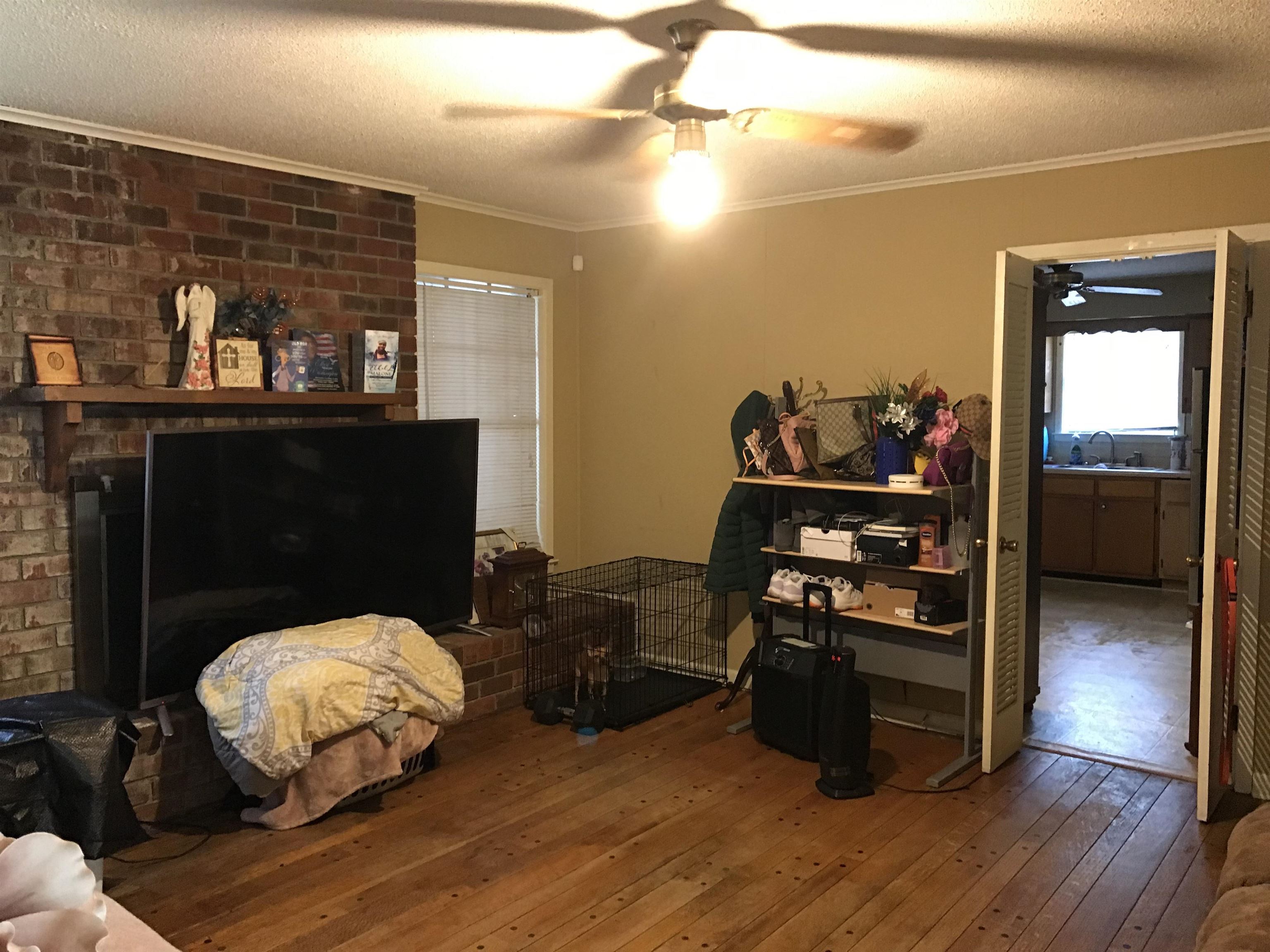 3409 Adrick Road Memphis, TN 38128 - Photo 8 of 14 a living room with furniture and a wooden floor