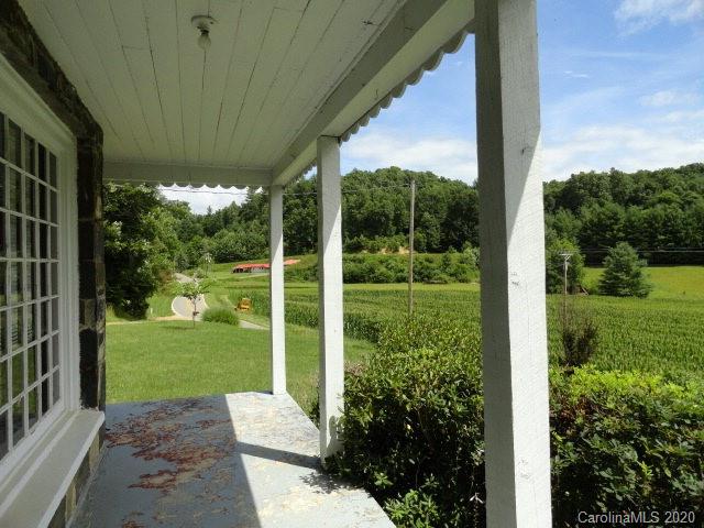 5215 Double Island Road Green Mountain, NC 28740 - Photo 11 of 14 a view of backyard with plants and garden