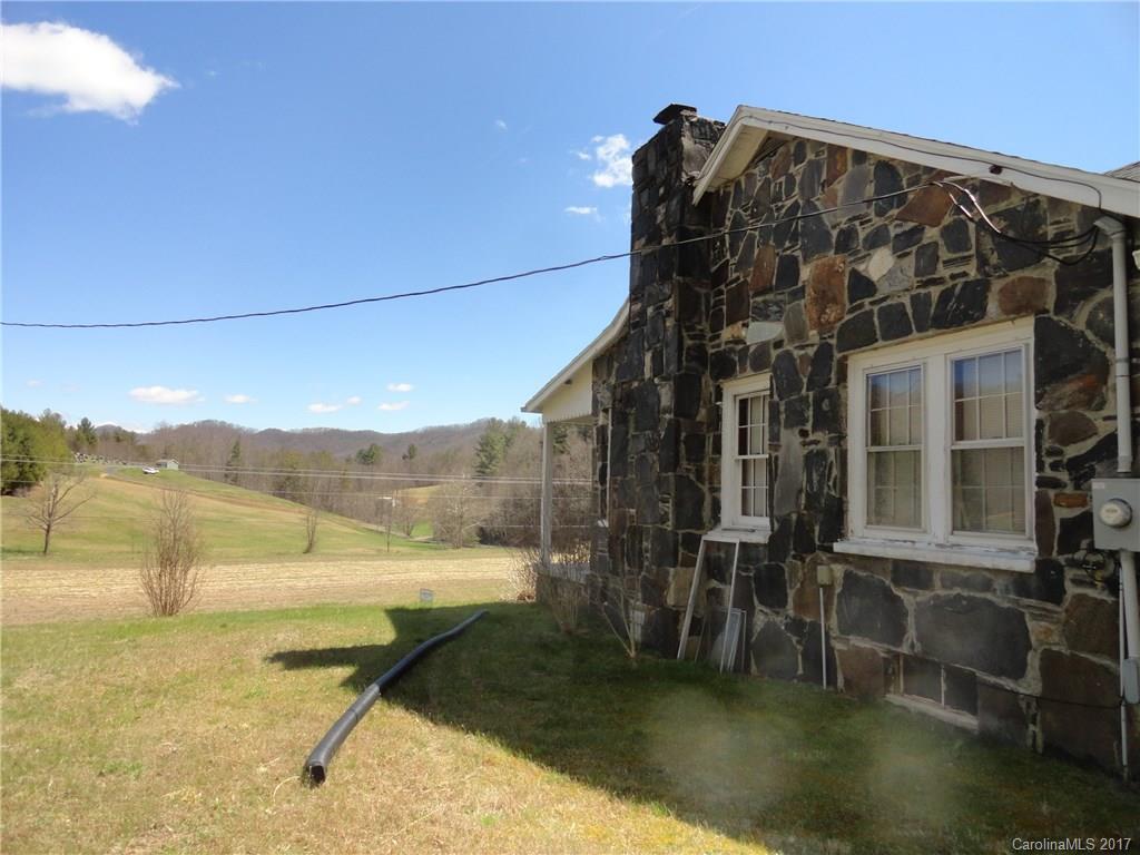 5215 Double Island Road Green Mountain, NC 28740 - Photo 3 of 14 a view of a house with a yard