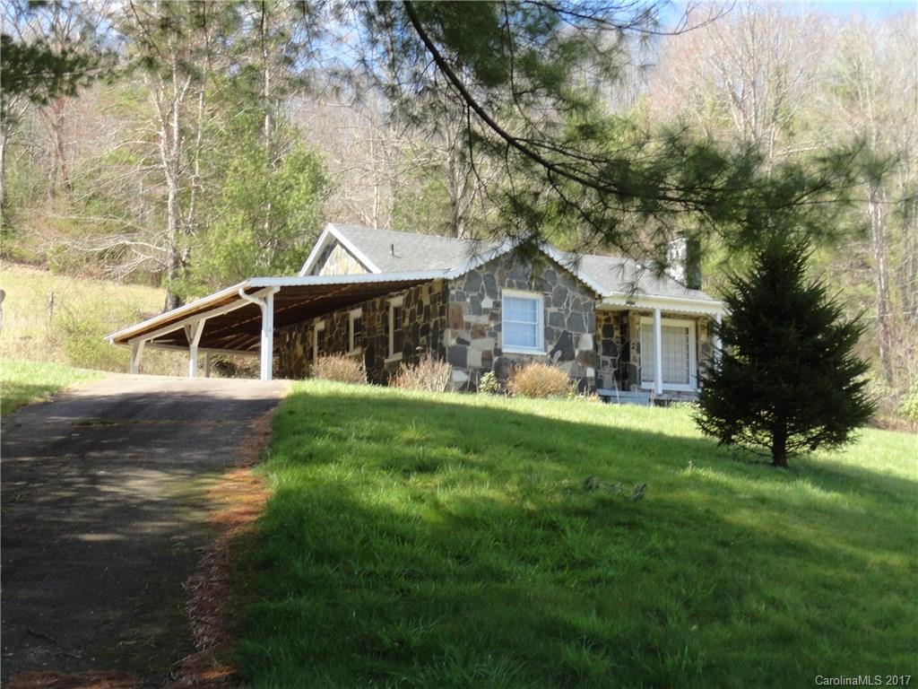 5215 Double Island Road Green Mountain, NC 28740 - Photo 4 of 14 a front view of house with yard and green space
