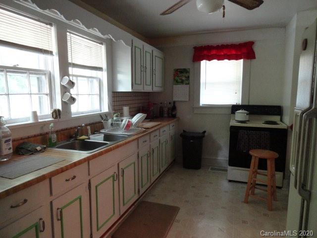 5215 Double Island Road Green Mountain, NC 28740 - Photo 7 of 14 a kitchen with a sink stove and cabinets