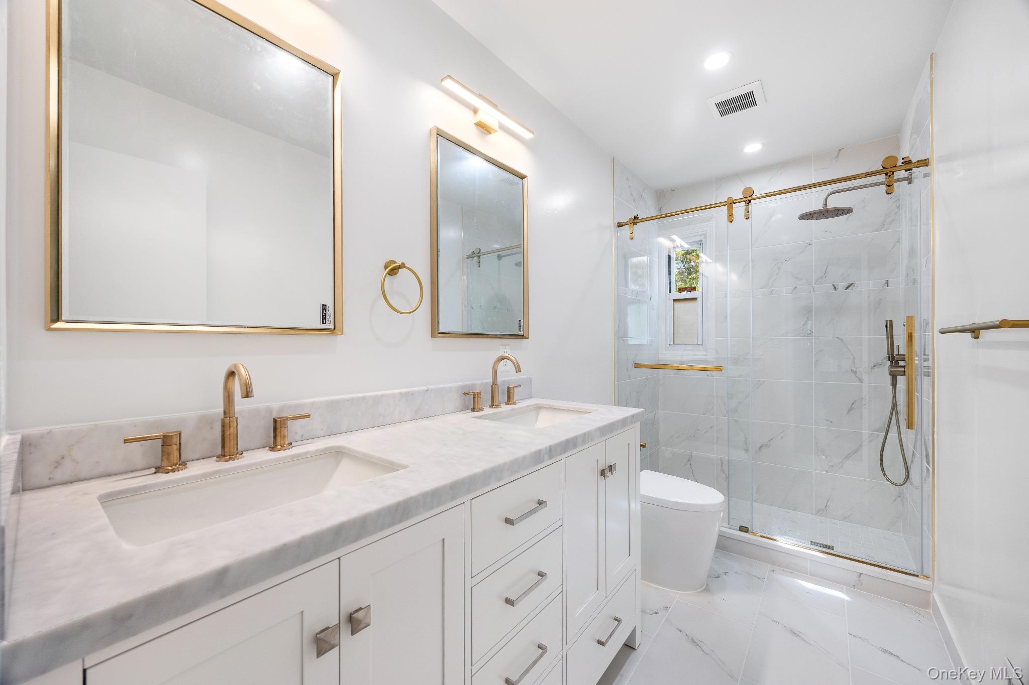 372 Heathcote Road Scarsdale, NY 10583 - Photo 11 of 20 Full bath with a marble finish shower, double vanity, light marble finish flooring, and recessed lighting