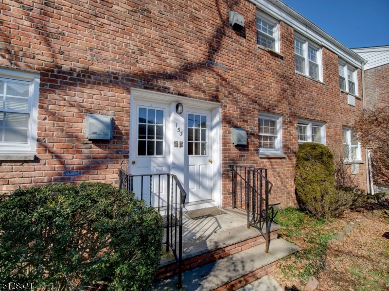 153 Ridge Road, Unit D Cedar Grove, NJ 07009 - Photo 4 of 21 a front view of a house with a garden