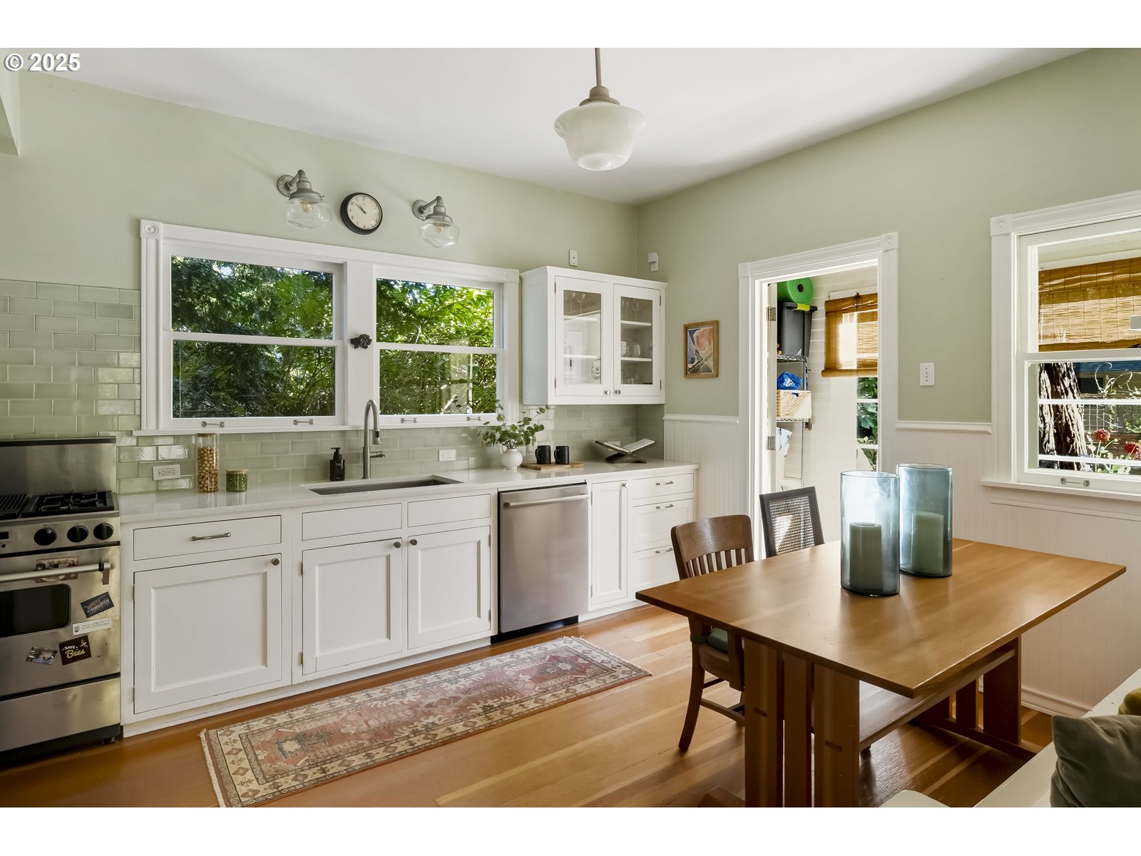 2744 Northeast 16th Avenue Portland, OR 97212 - Photo 14 of 47 a kitchen with a table chairs stove and cabinets