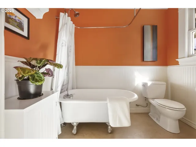 a bathroom with a sink toilet and mirror