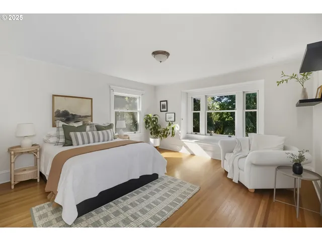 a bedroom with a bed and a couch