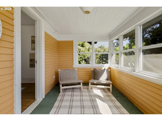 a balcony with chairs and with outdoor views