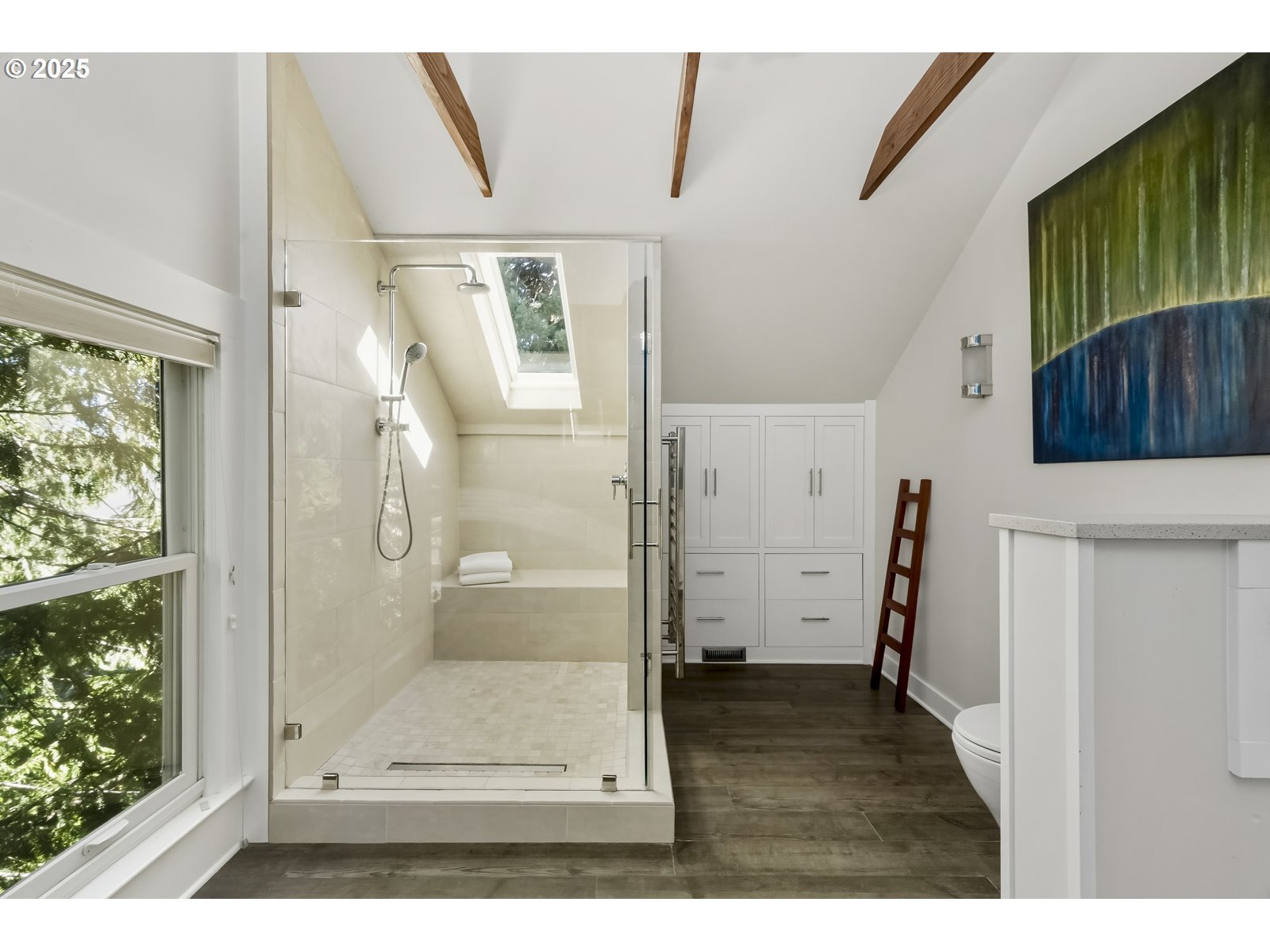 2744 Northeast 16th Avenue Portland, OR 97212 - Photo 37 of 47 a view of a bathroom with a glass door shower and a sink