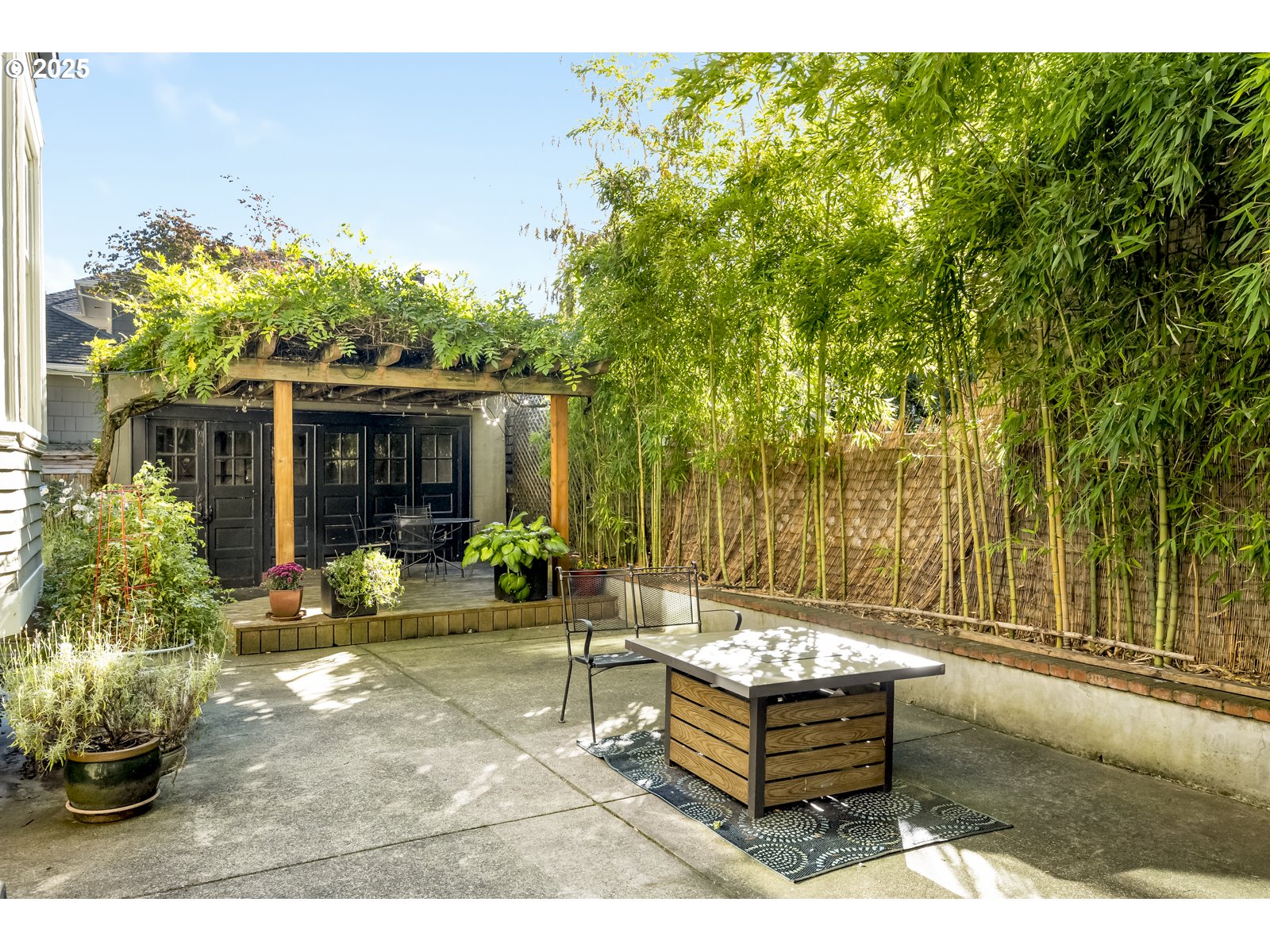 2744 Northeast 16th Avenue Portland, OR 97212 - Photo 44 of 47 a backyard of a house with table and chairs