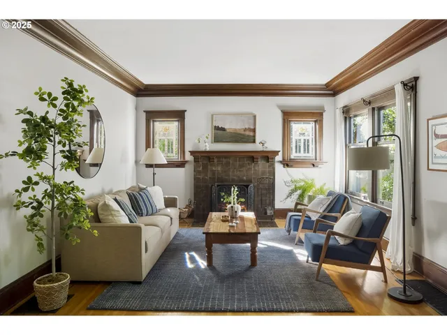 a living room with furniture and a fireplace
