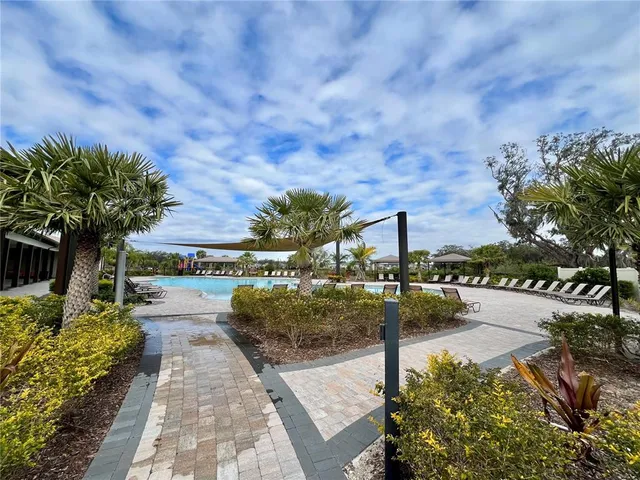 a view of a swimming pool with a yard