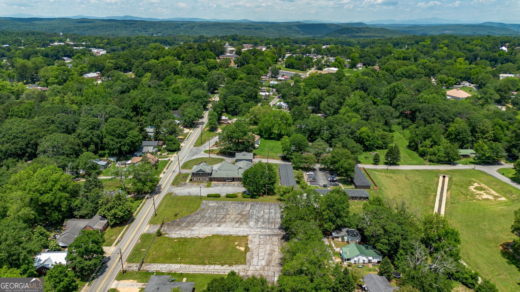 128 Branch Street Toccoa, GA 30577 - Photo 37 of 38 an aerial view of residential houses with outdoor space and trees