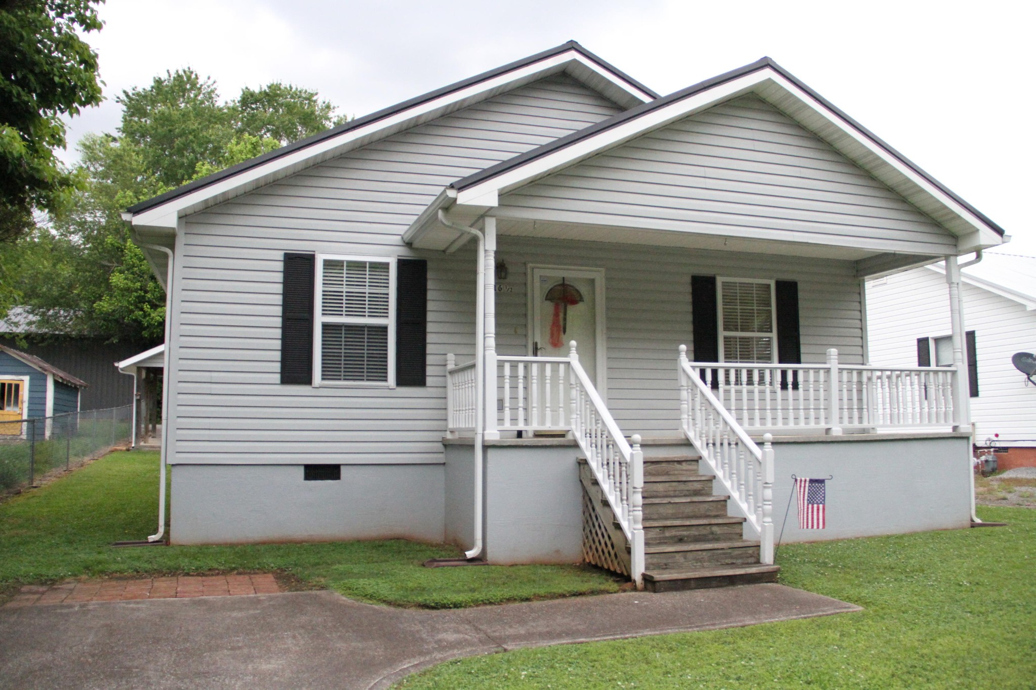61612 Steekee Road Loudon, TN 37774 - Photo 1 of 23 a front view of a white house with a yard