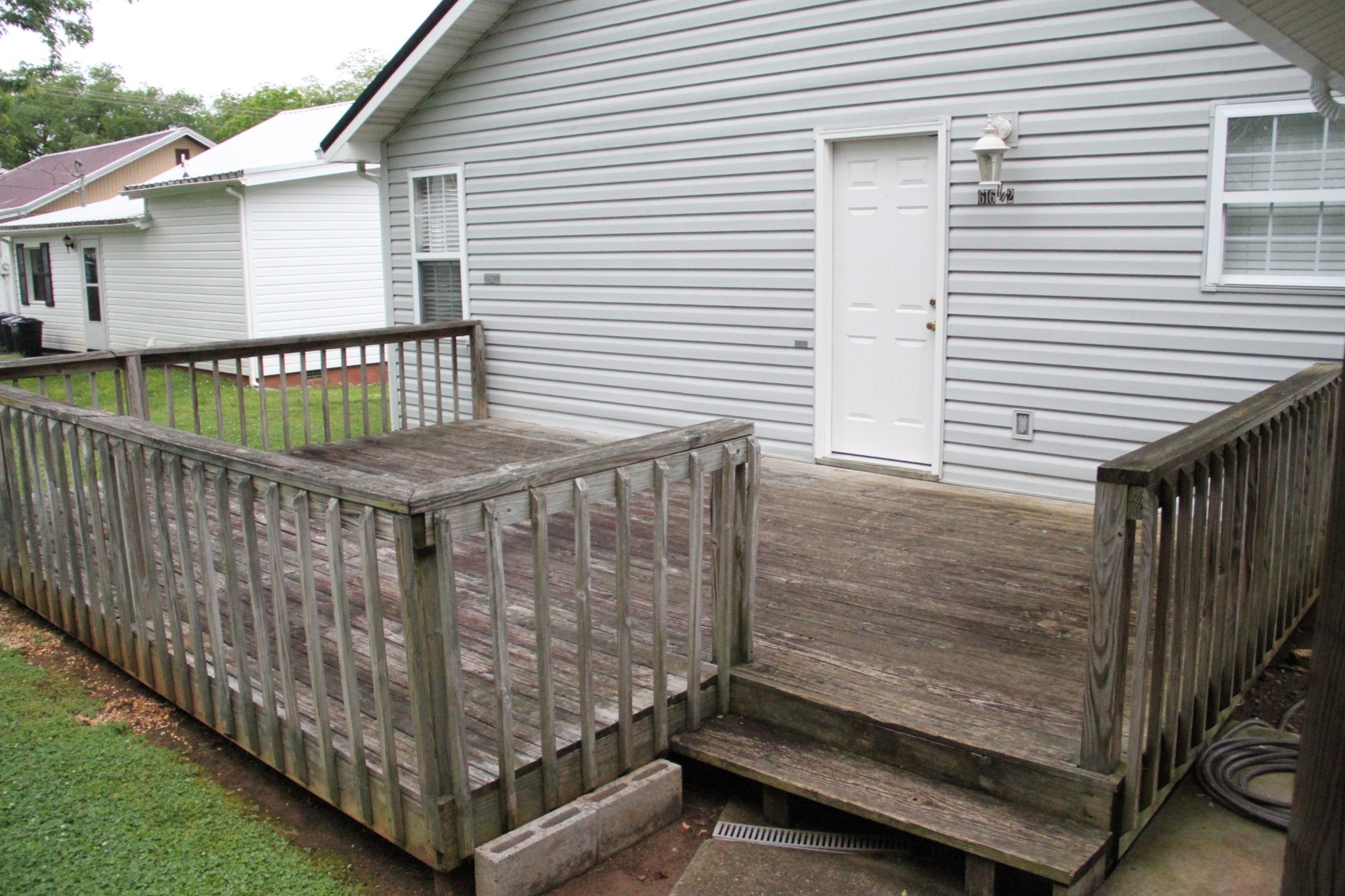 61612 Steekee Road Loudon, TN 37774 - Photo 20 of 23 a view of a backyard with a small deck and wooden floor