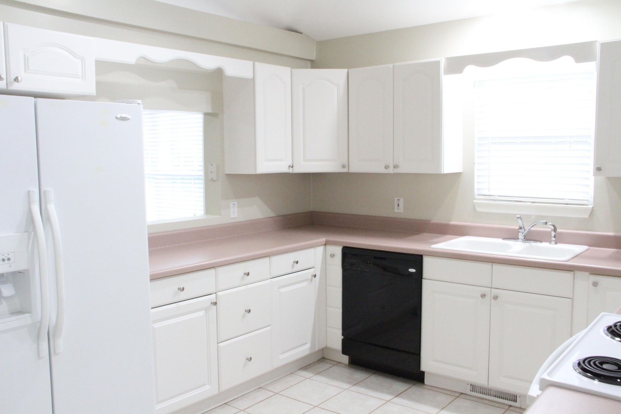 61612 Steekee Road Loudon, TN 37774 - Photo 4 of 23 a kitchen with white cabinets appliances a sink and a window