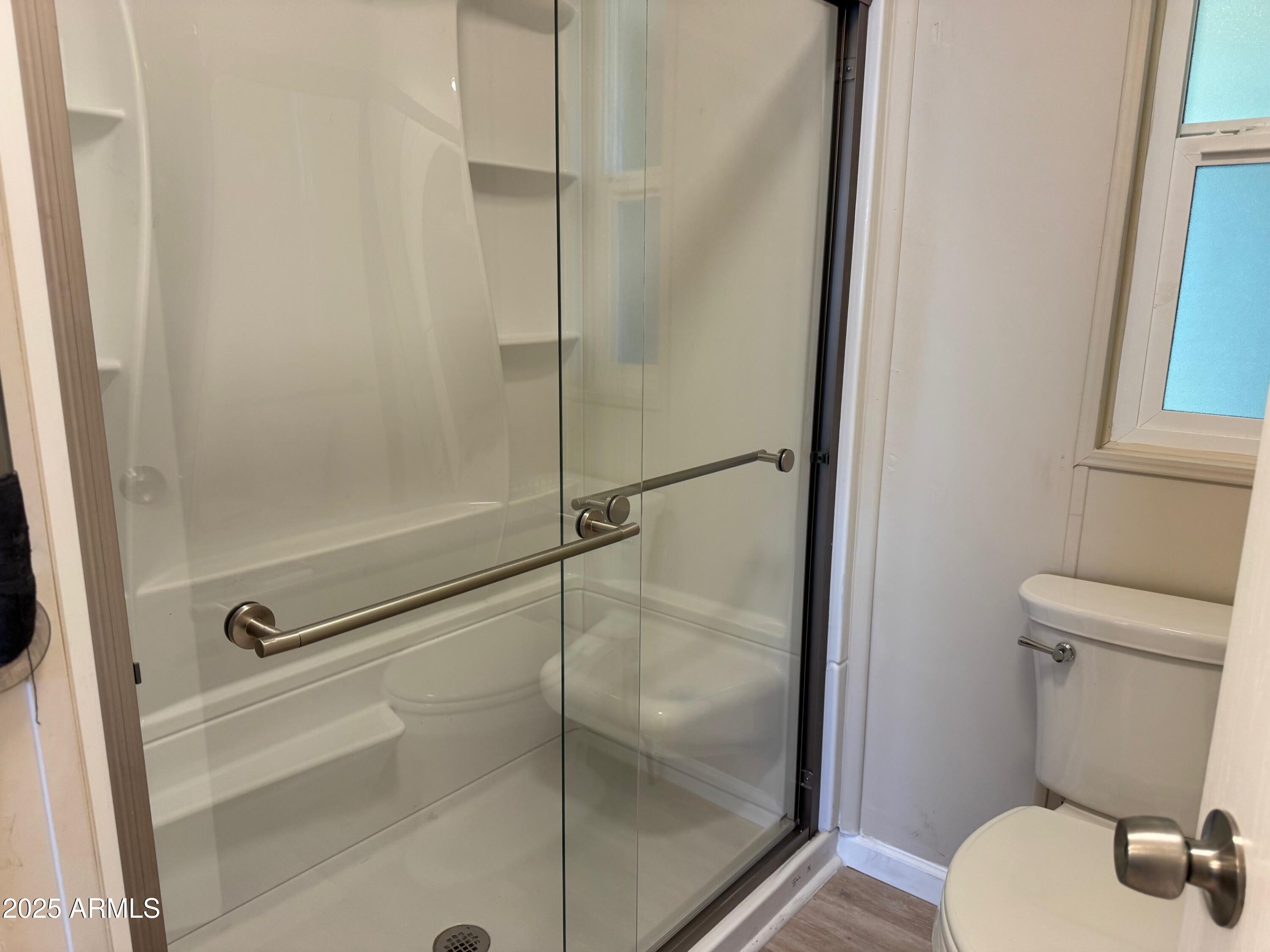 3901 East Pinnacle Peak Road, Unit 108 Phoenix, AZ 85050 - Photo 14 of 30 a bathroom with a shower and toilet