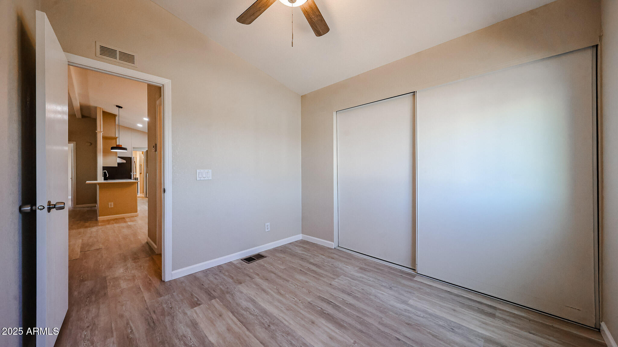 3901 East Pinnacle Peak Road, Unit 108 Phoenix, AZ 85050 - Photo 17 of 30 wooden floor in an empty room