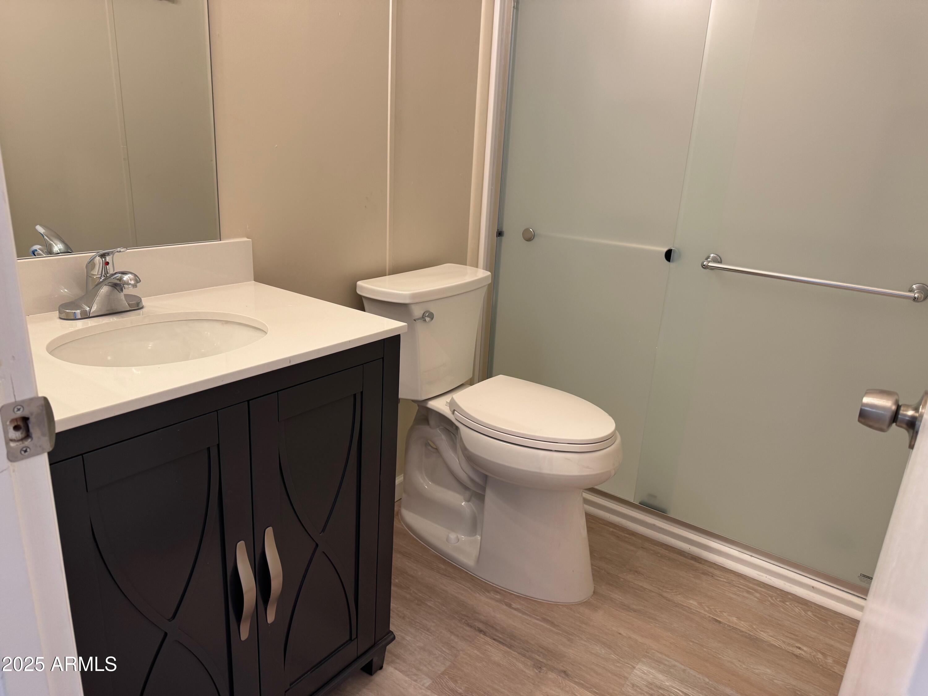 3901 East Pinnacle Peak Road, Unit 108 Phoenix, AZ 85050 - Photo 19 of 30 a bathroom with a sink and a toilet