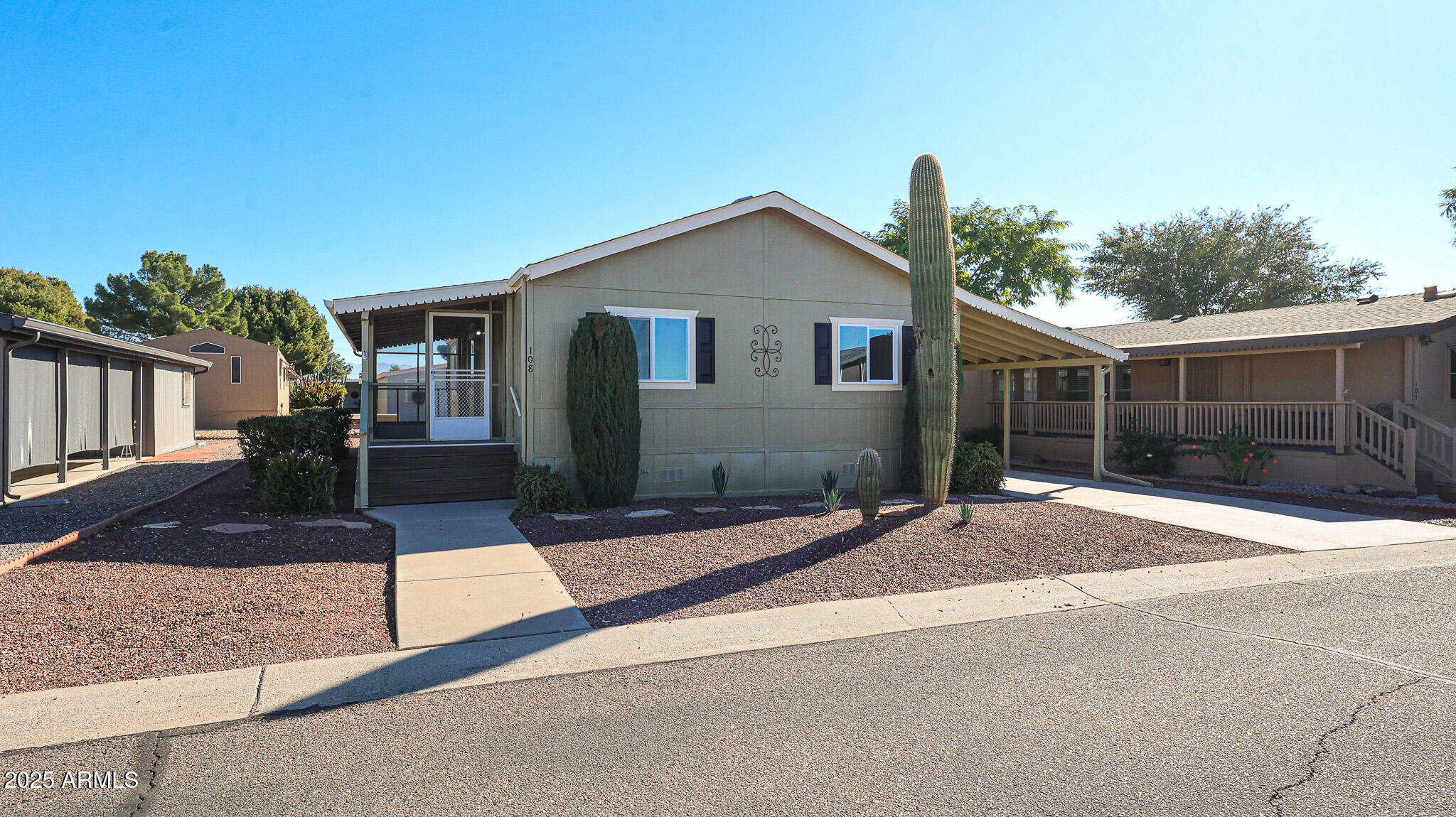 3901 East Pinnacle Peak Road, Unit 108 Phoenix, AZ 85050 - Photo 2 of 30 a front view of house with yard