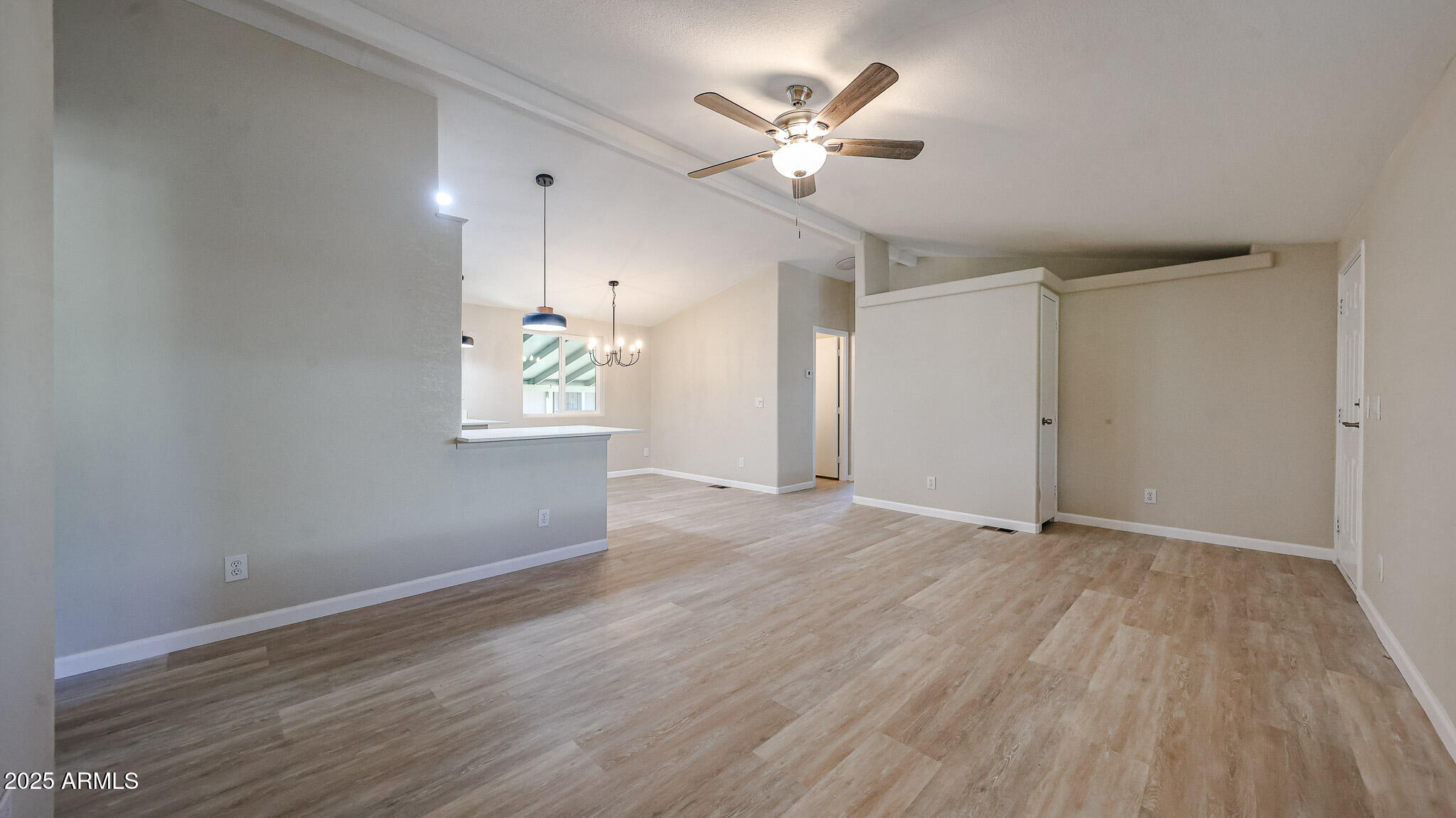3901 East Pinnacle Peak Road, Unit 108 Phoenix, AZ 85050 - Photo 21 of 30 wooden floor in an empty room with a window