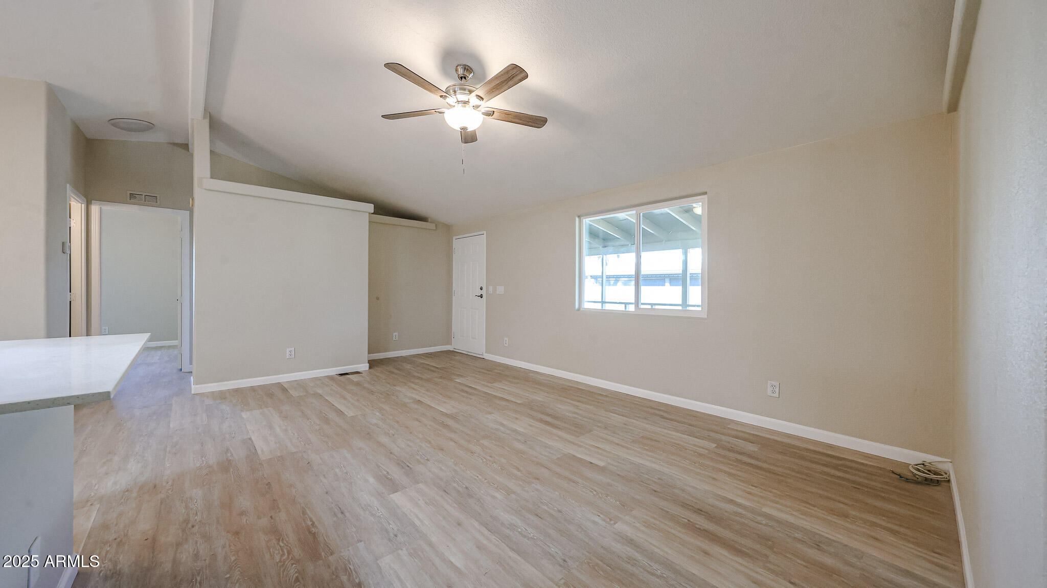 3901 East Pinnacle Peak Road, Unit 108 Phoenix, AZ 85050 - Photo 22 of 30 wooden floor in an empty room with a window
