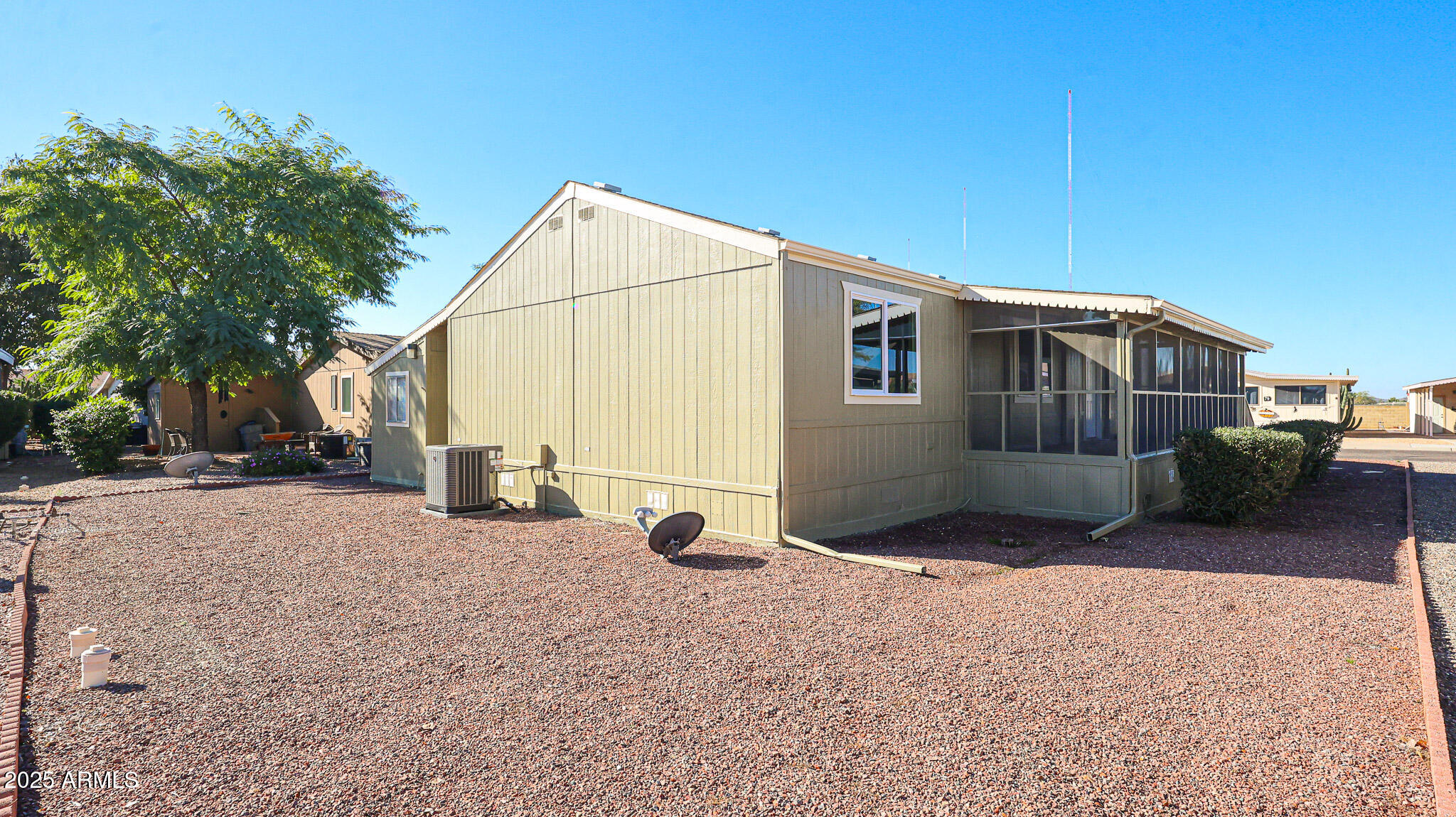 3901 East Pinnacle Peak Road, Unit 108 Phoenix, AZ 85050 - Photo 26 of 30 a view of a house with backyard and sitting area