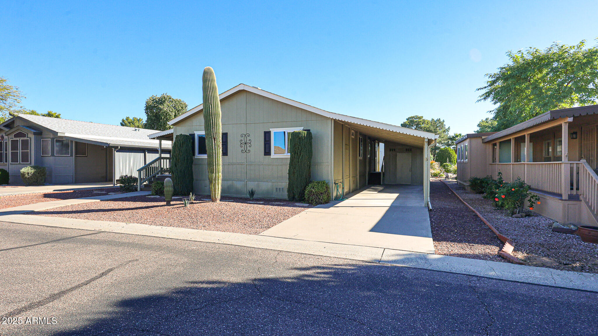 3901 East Pinnacle Peak Road, Unit 108 Phoenix, AZ 85050 - Photo 30 of 30 a front view of house with garage and yard