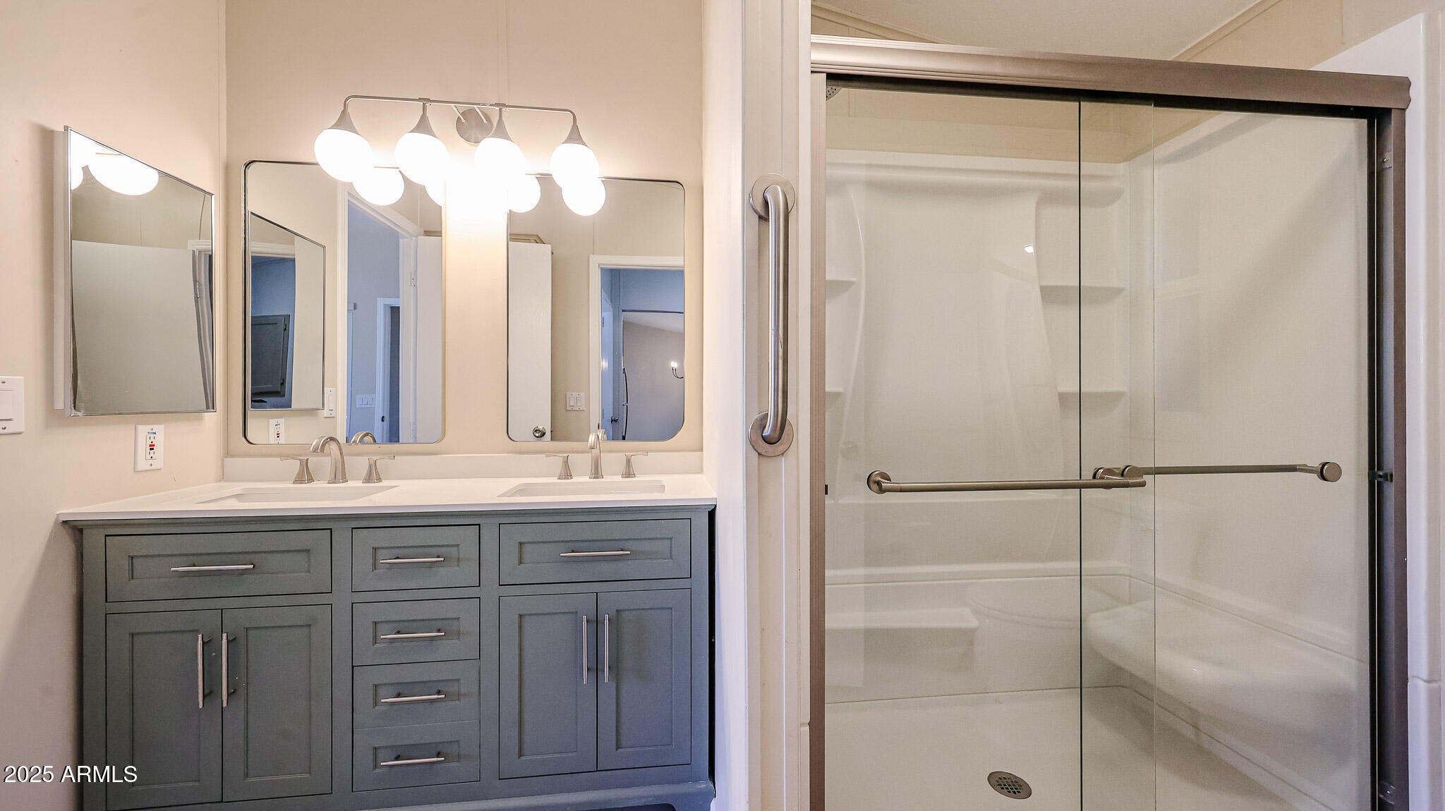 3901 East Pinnacle Peak Road, Unit 108 Phoenix, AZ 85050 - Photo 9 of 30 a bathroom with a granite countertop sink mirror and a shower