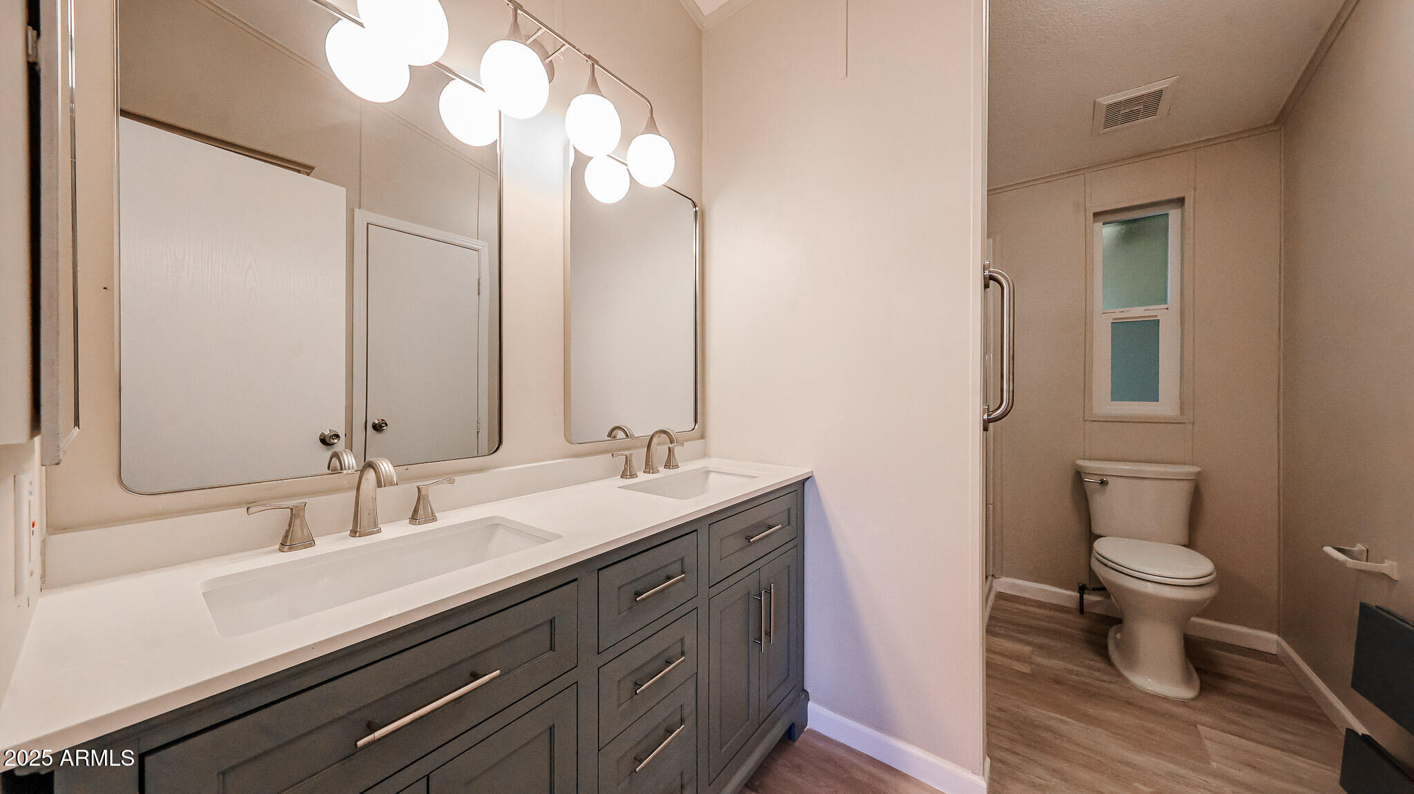 3901 East Pinnacle Peak Road, Unit 108 Phoenix, AZ 85050 - Photo 10 of 30 a bathroom with double sink and a mirror