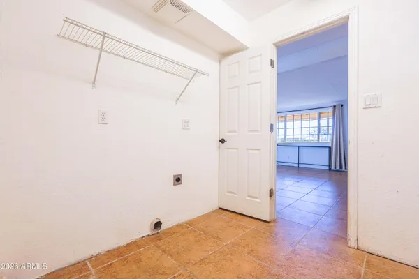 a view of an empty room with a window