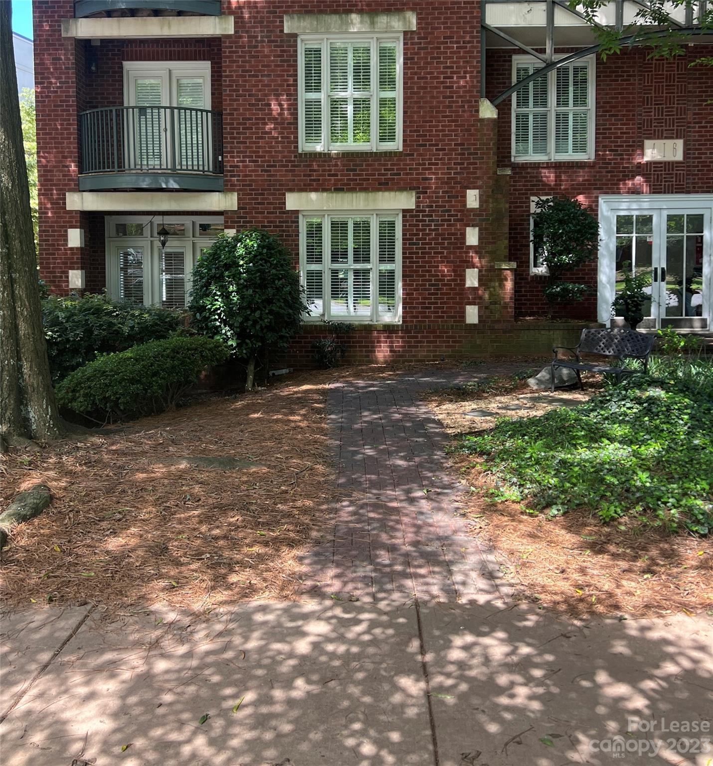 416 Queens Road Charlotte, NC 28207 - Photo 2 of 2 a view of a building with a yard