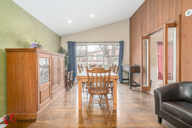 52 Monee Road Park Forest, IL 60466 - Photo 3 of 22 a view of a livingroom with furniture window and wooden floor