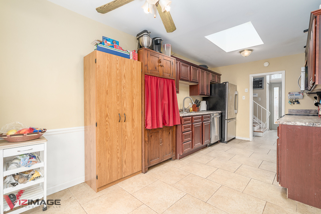 52 Monee Road Park Forest, IL 60466 - Photo 8 of 22 a kitchen with stainless steel appliances a refrigerator and a stove