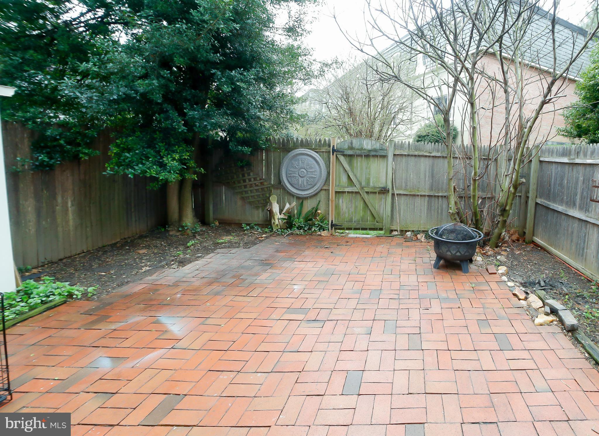 8113 Kingsview Court, Unit 207 Springfield, VA 22152 - Photo 22 of 28 Fenced Brick Patio