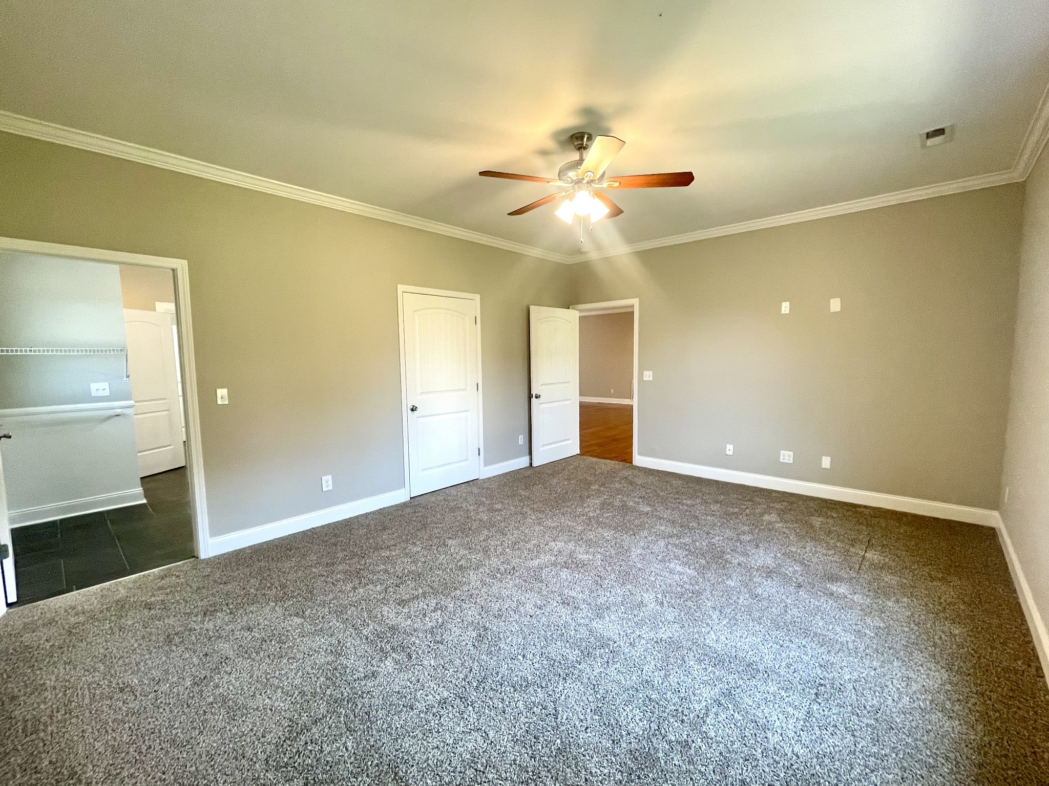 10591 Bell Station Road Oak Grove, KY 42262 - Photo 13 of 35 an empty room with fan and entrance
