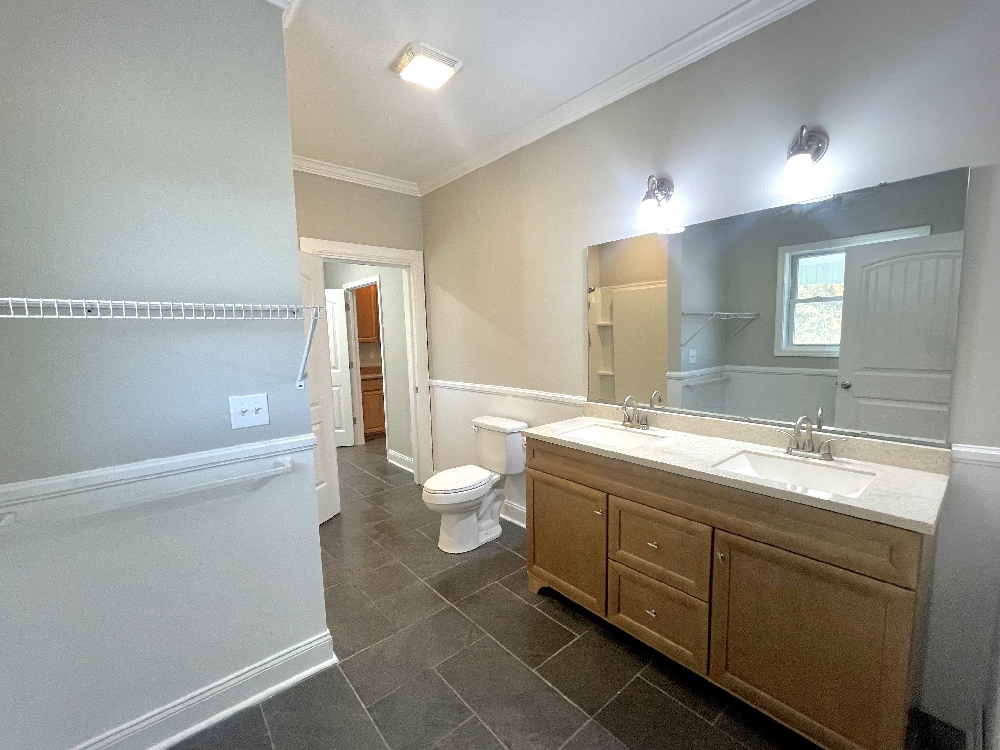 10591 Bell Station Road Oak Grove, KY 42262 - Photo 16 of 35 a spacious bathroom with a granite countertop sink mirror and toilet