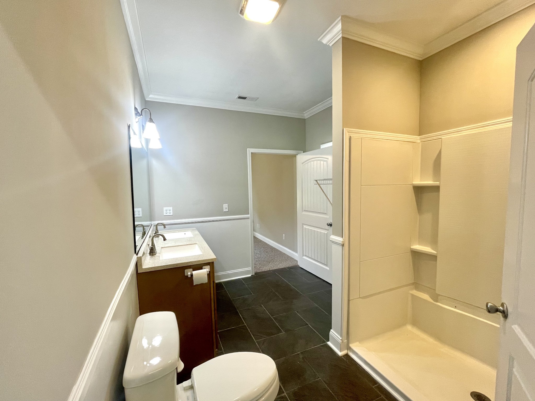 10591 Bell Station Road Oak Grove, KY 42262 - Photo 17 of 35 a bathroom with a granite countertop sink mirror vanity and toilet