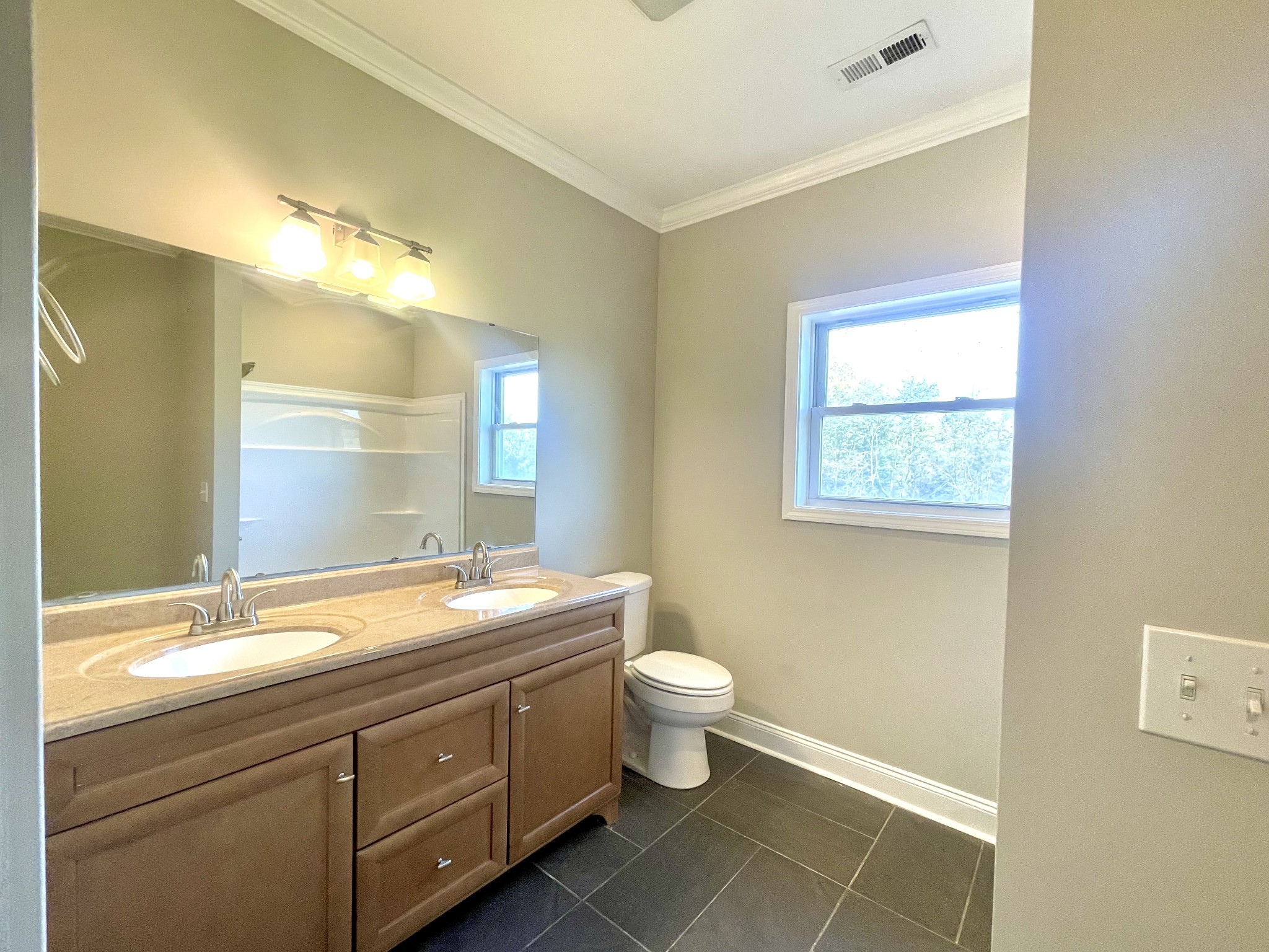 10591 Bell Station Road Oak Grove, KY 42262 - Photo 20 of 35 a bathroom with a double vanity sink and a mirror
