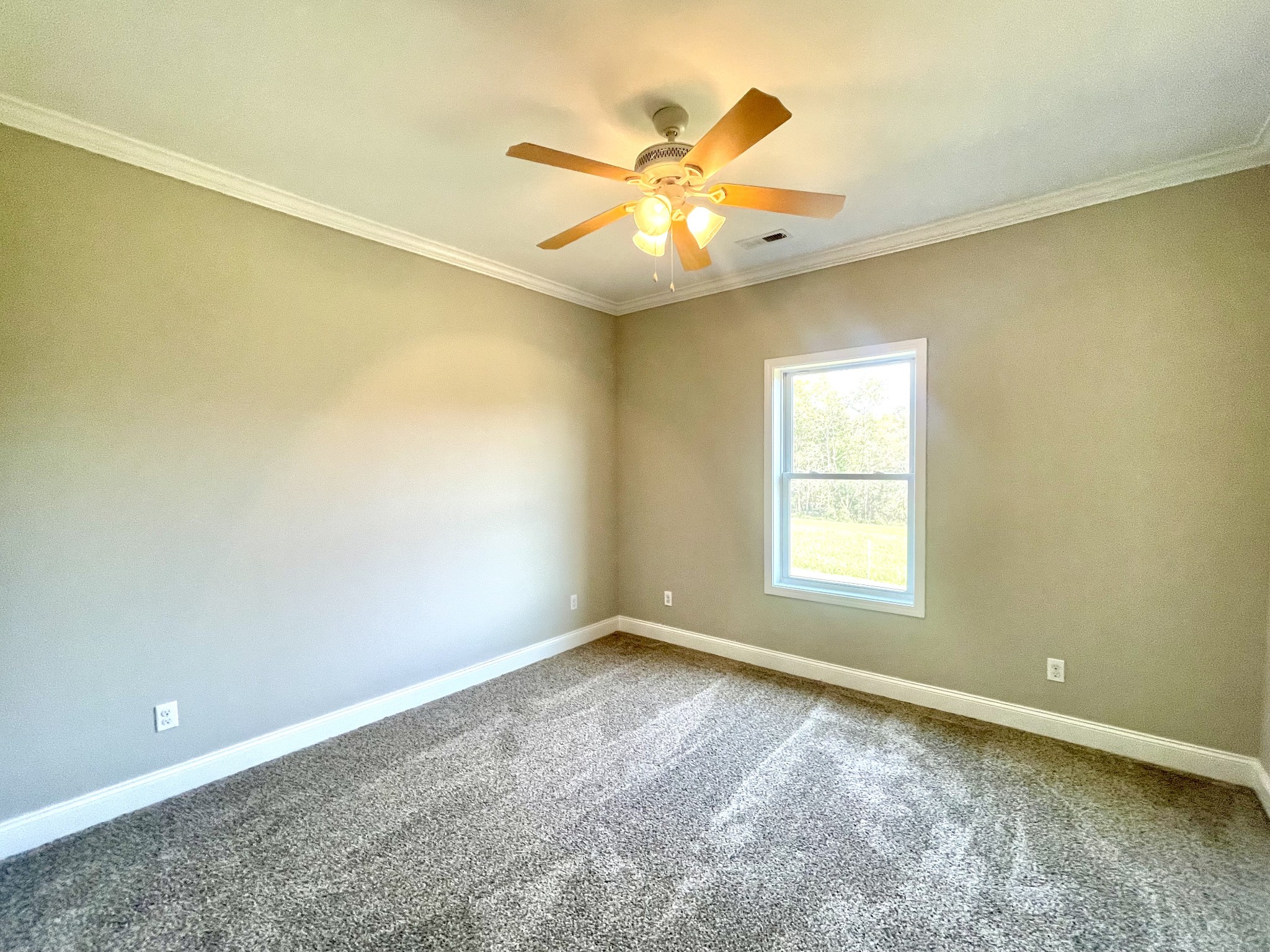 10591 Bell Station Road Oak Grove, KY 42262 - Photo 22 of 35 an empty room with a window and a fan