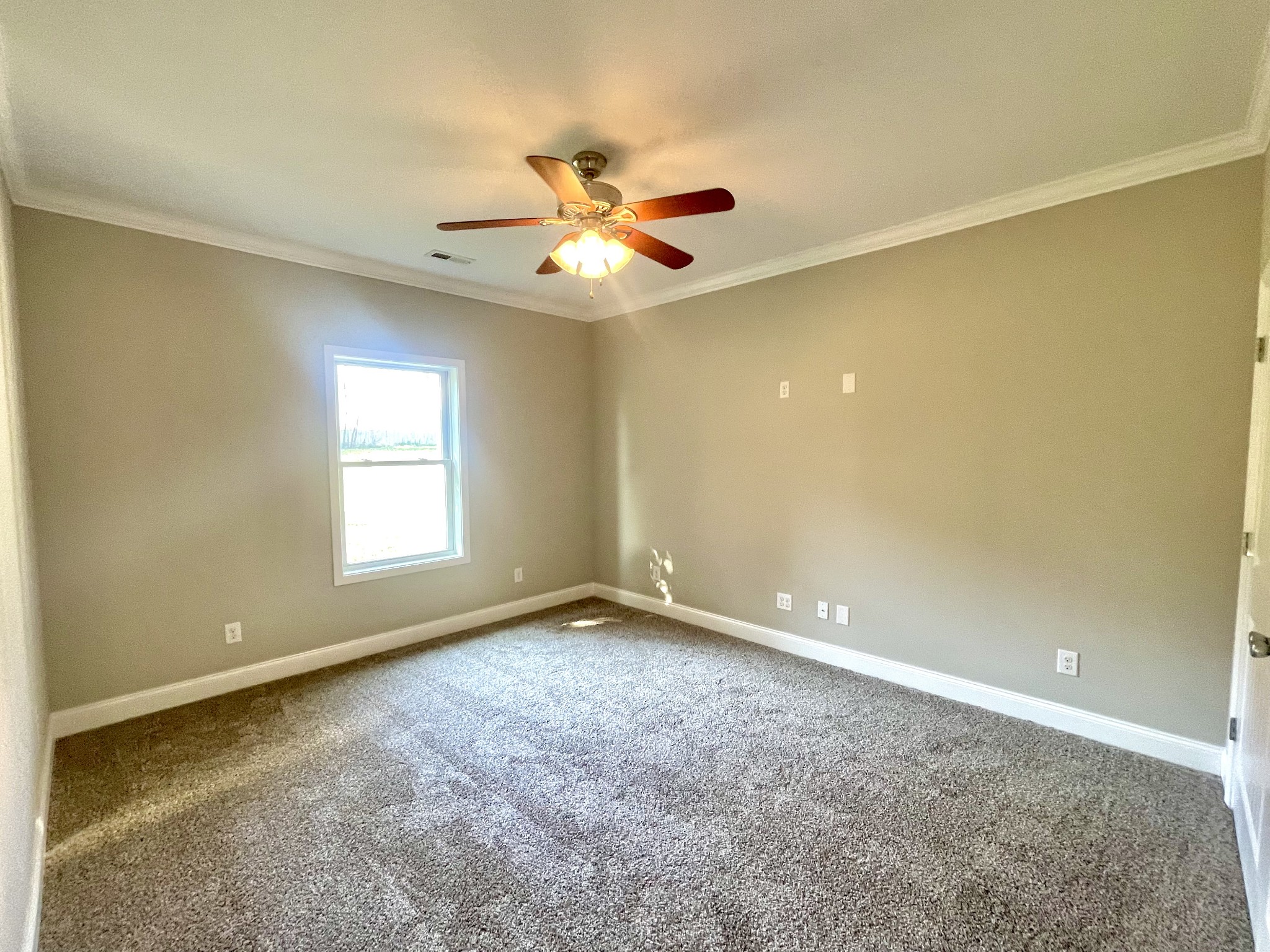 10591 Bell Station Road Oak Grove, KY 42262 - Photo 26 of 35 an empty room with windows and fan