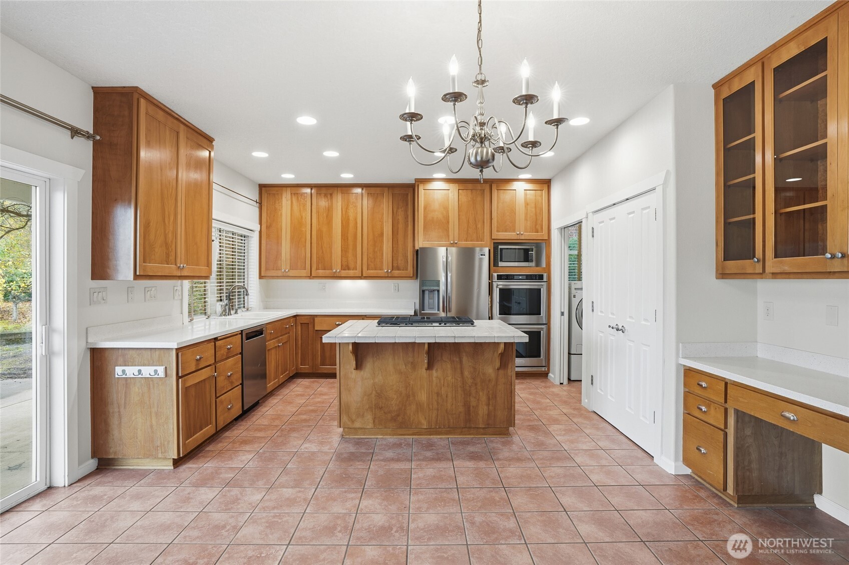 3550 Northeast 214th Avenue Fairview, OR 97024 - Photo 11 of 40 a large kitchen with a large counter top space appliances and cabinets