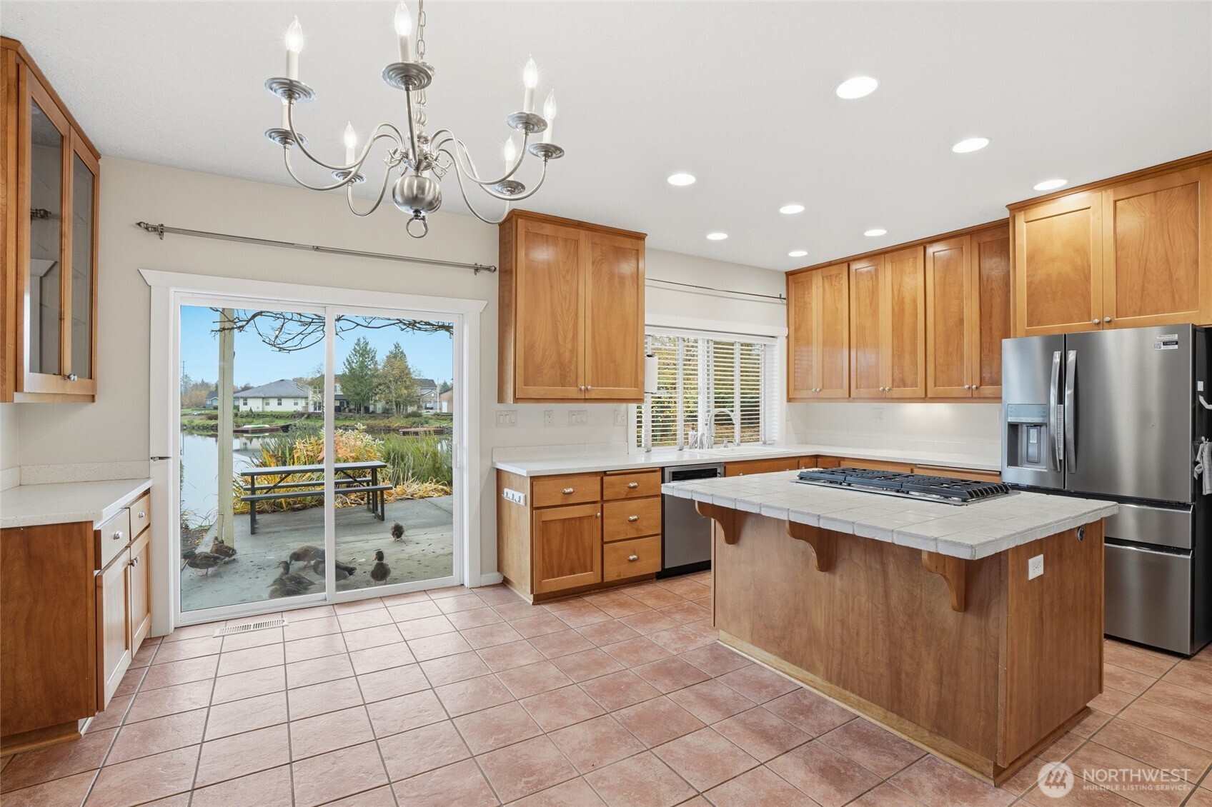 3550 Northeast 214th Avenue Fairview, OR 97024 - Photo 12 of 40 a kitchen with a stove a sink a refrigerator and wooden cabinets