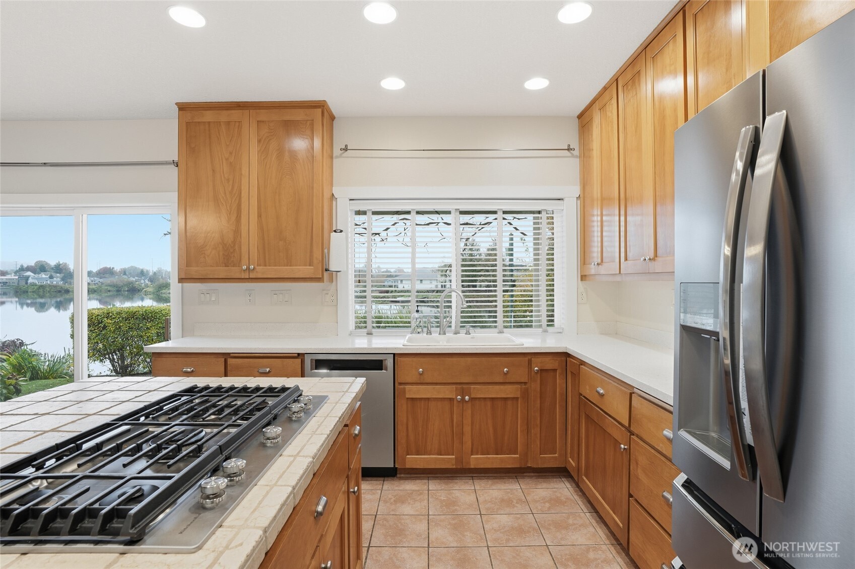 3550 Northeast 214th Avenue Fairview, OR 97024 - Photo 13 of 40 a kitchen with a sink stove and refrigerator