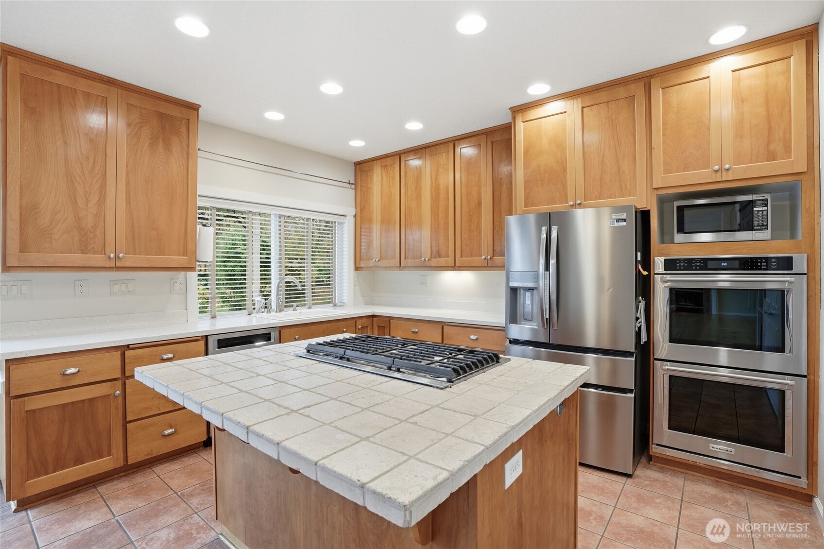 3550 Northeast 214th Avenue Fairview, OR 97024 - Photo 14 of 40 a kitchen with a stove a microwave and a refrigerator