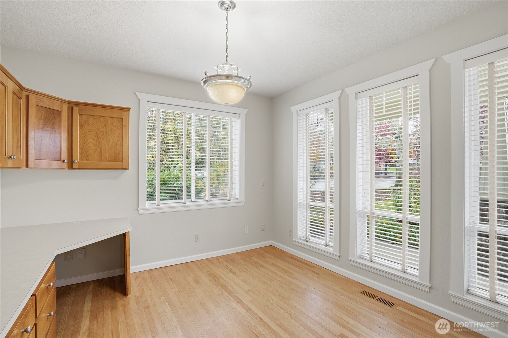 3550 Northeast 214th Avenue Fairview, OR 97024 - Photo 16 of 40 a view of an empty room with wooden floor and a window