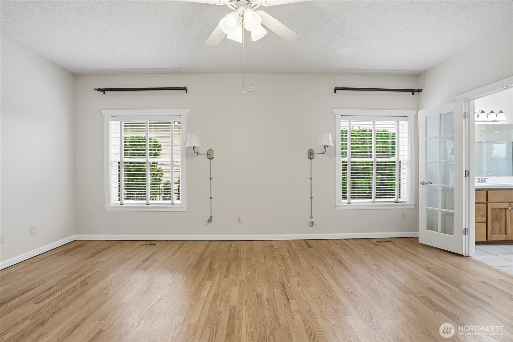 3550 Northeast 214th Avenue Fairview, OR 97024 - Photo 17 of 40 an empty room with wooden floor and windows